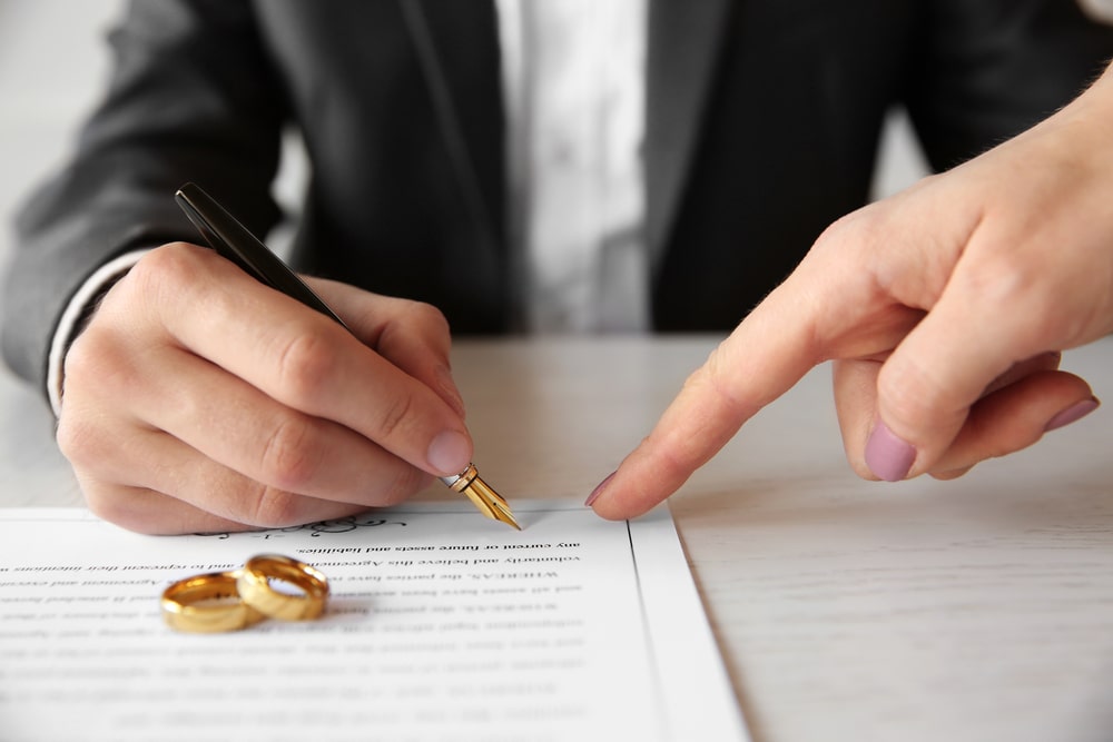Man Signing A Contract - Jones Divorce & Family Law