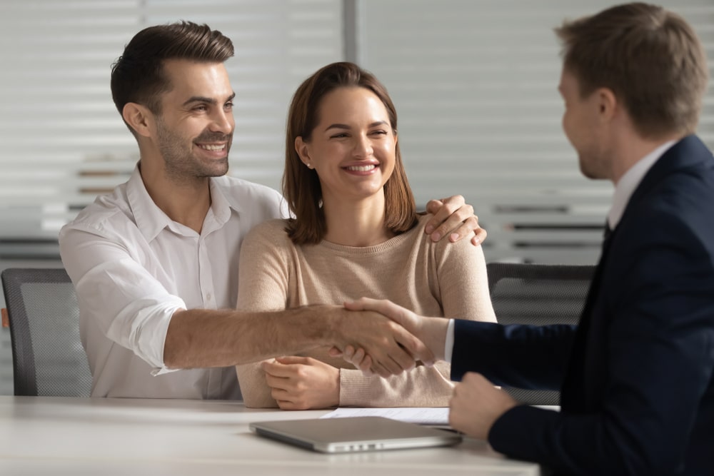 Happy Young Couple Handshake Lawyer - Jones Divorce & Family Law